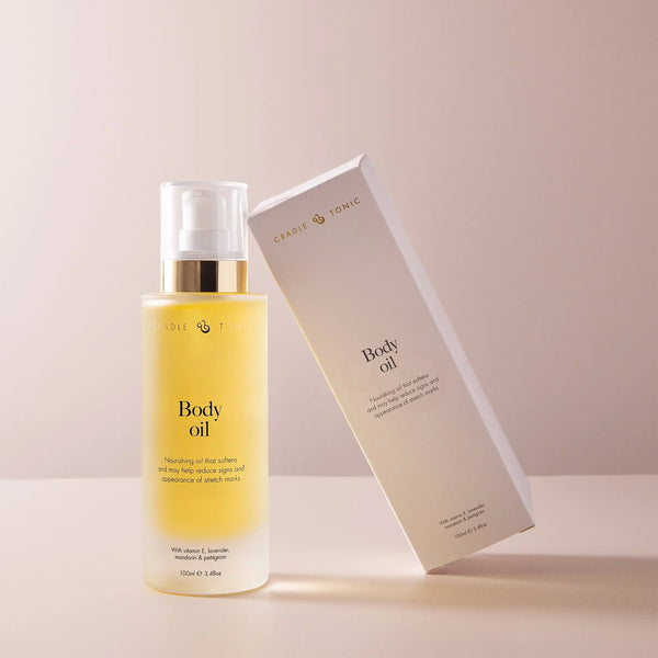 Pregnancy Stretch Mark Oil | Natural Body Oil for Bump Care in a clear pump bottle with matching box. Ideal for hydrating and soothing skin.