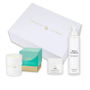 New Mum Gift Set | Natural Skincare and Candle Gift featuring shower gel, balm, baby cream, and a scented candle in a luxury white box. Ideal for postnatal care and gifting.