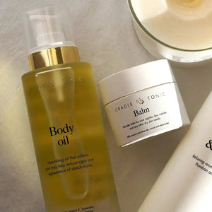 Pregnancy Stretch Mark Oil | Natural Body Oil for Bump Care in a frosted pump bottle with gold cap, ideal for hydrating and reducing stretch marks.