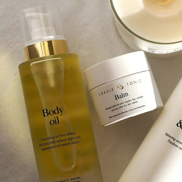 Pregnancy Stretch Mark Oil | Natural Body Oil for Bump Care in a frosted pump bottle with gold cap, ideal for hydrating and reducing stretch marks.