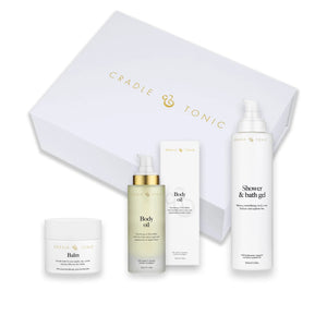 Pregnancy Skincare Gift Set | Natural Essentials for Mum-to-Be featuring balm, body oil, and bath gel in elegant white packaging. Ideal for sensitive skin care during pregnancy.