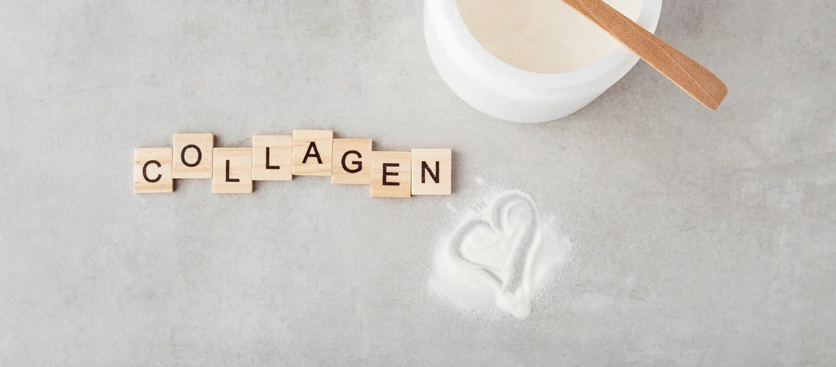 Collagen powder supplement for pregnancy skincare with text ‘Collagen’ on a grey surface