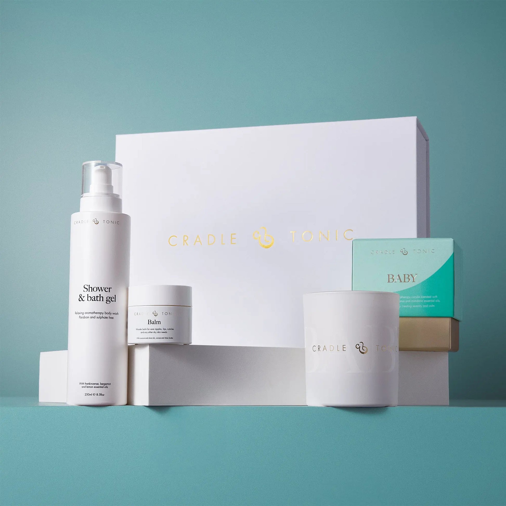 New Mum Gift Set | Natural Skincare and Candle Gift featuring shower gel, balm, and candle in elegant white packaging. Ideal for postnatal care.