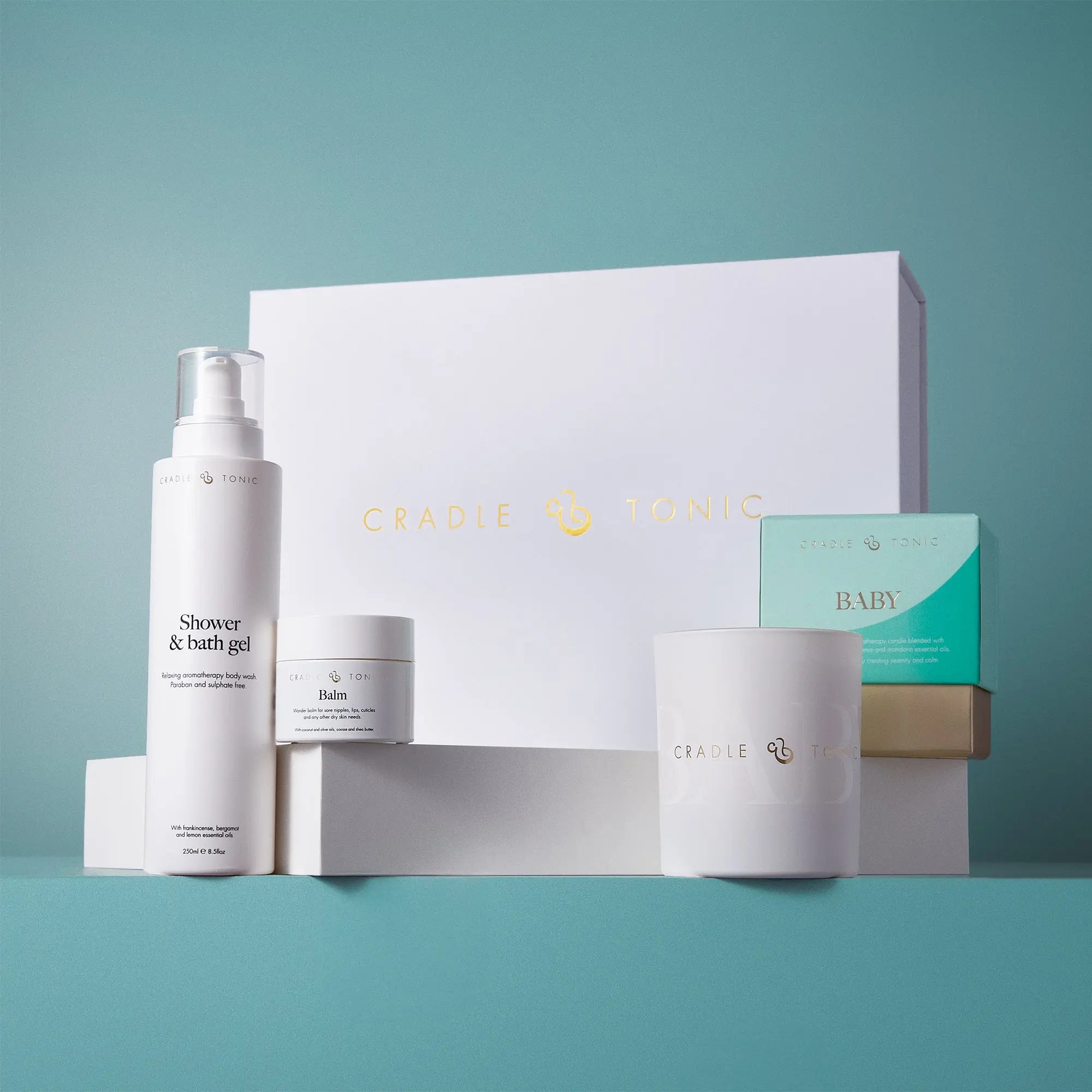 New Mum Gift Set | Natural Skincare and Candle Gift featuring shower gel, balm, and candle in elegant white packaging. Ideal for postnatal care.