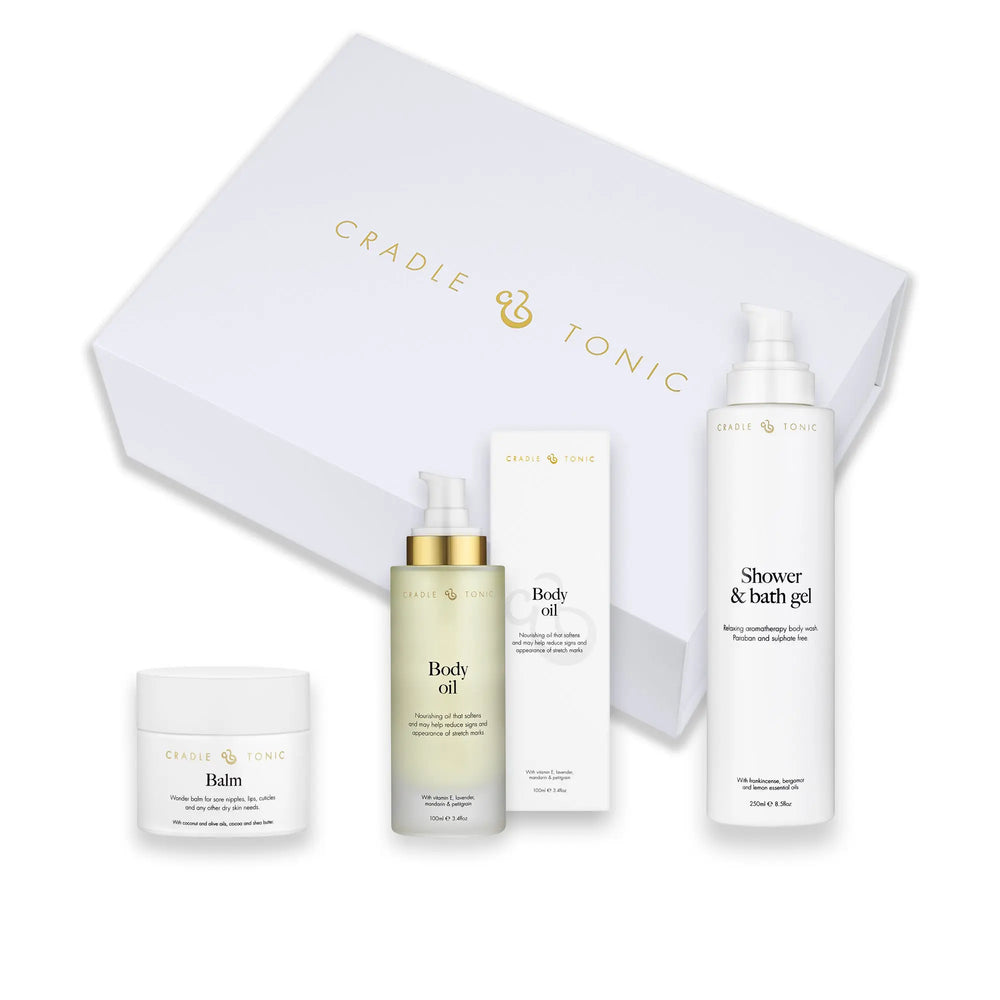 Pregnancy Skincare Gift Set | Natural Essentials for Mum-to-Be featuring balm, body oil, and bath gel in elegant white packaging. Ideal for sensitive skin care during pregnancy.